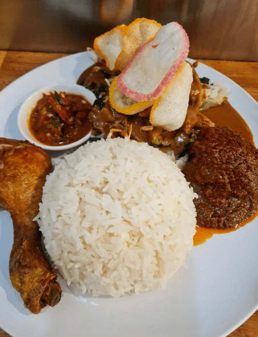Nasi Rames (Steamed Rice with Fried Chicken, Beef Rendang & Vegetables in Peanut Sauce)