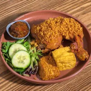 Ayam Penyet (Crispy Fried chicken, tofu, tempeh, spiced crumbs, belachan chilli)